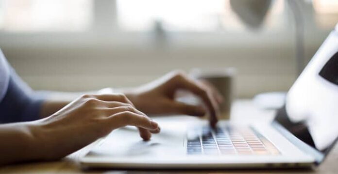 Woman using her laptop for working from home